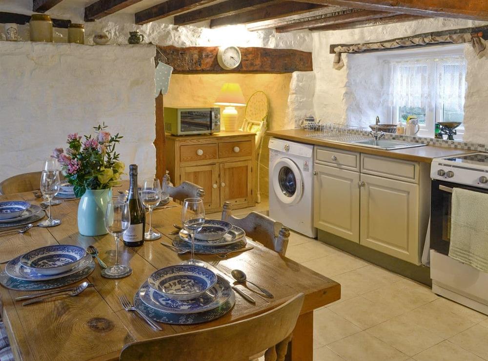 Convenient dining area within kitchen at Wren Cottage in Marian Cwm, near Prestatyn, Denbighshire