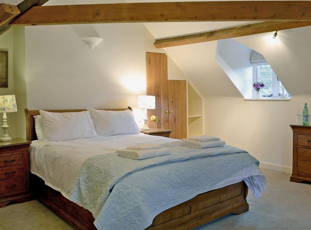 Beamed double bedroom full of character at Wrockwardine Cottage, 