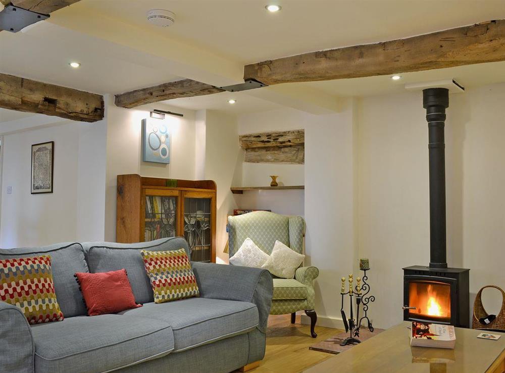 Cosy living room withwood-burning stove at Wrockwardine Cottage, 