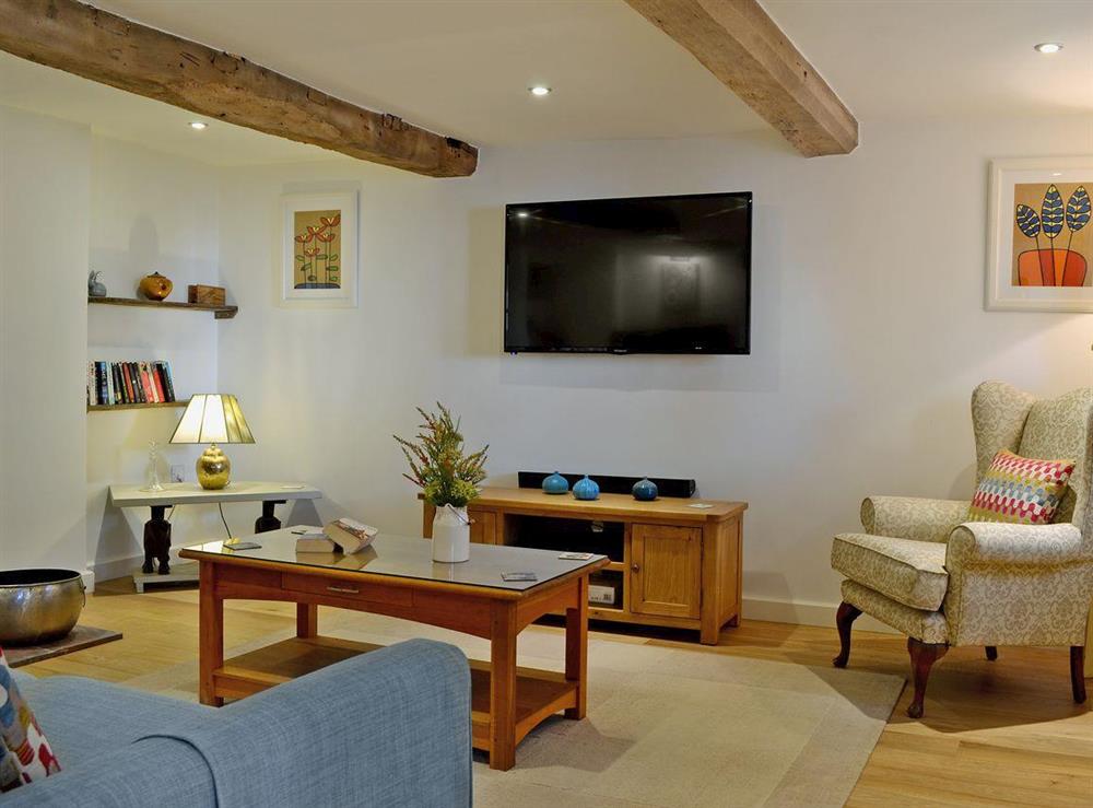 Living room with beamed ceiling at Wrockwardine Cottage, 