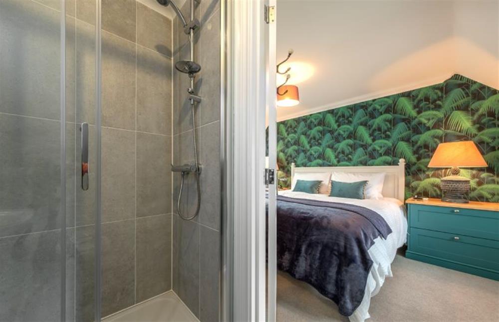 Second floor: En-suite shower looking back into master bedroom at Wye Cottage, Holt