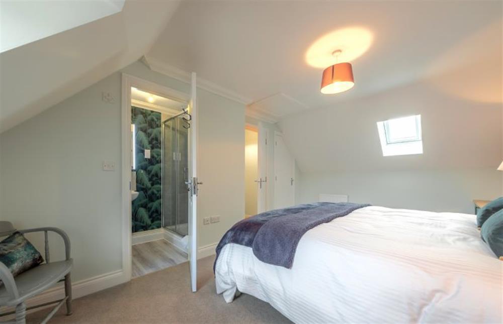 Second floor: Master bedroom with door to en-suite shower at Wye Cottage, Holt
