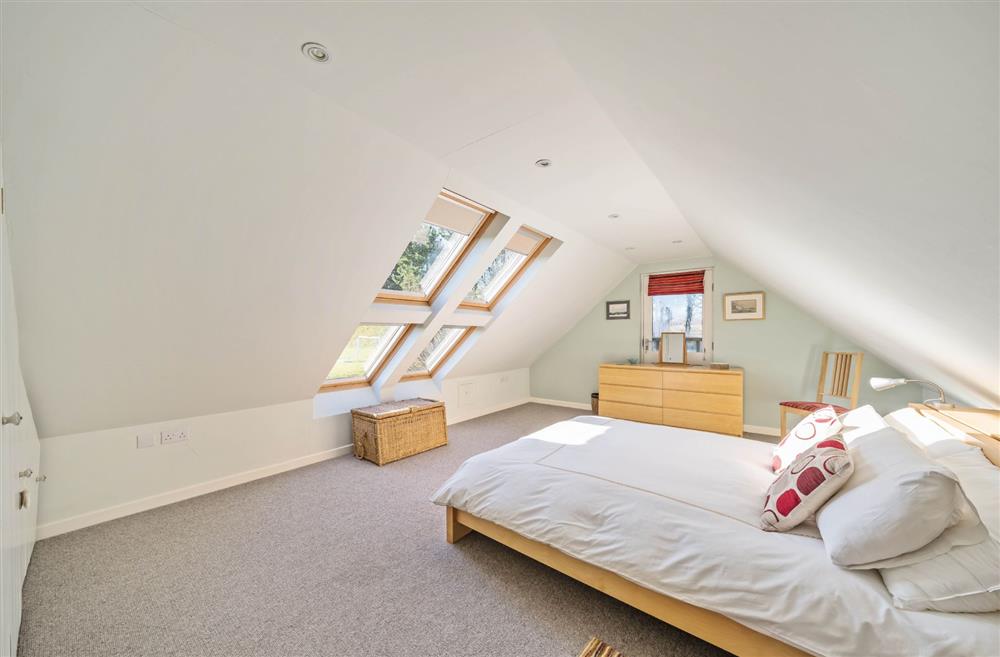 The generous super-kingsize bedroom at Wylye  Croft, Dorchester
