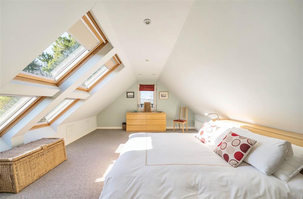 The super-king size bedroom with views across the garden at Wylye  Croft, Dorchester