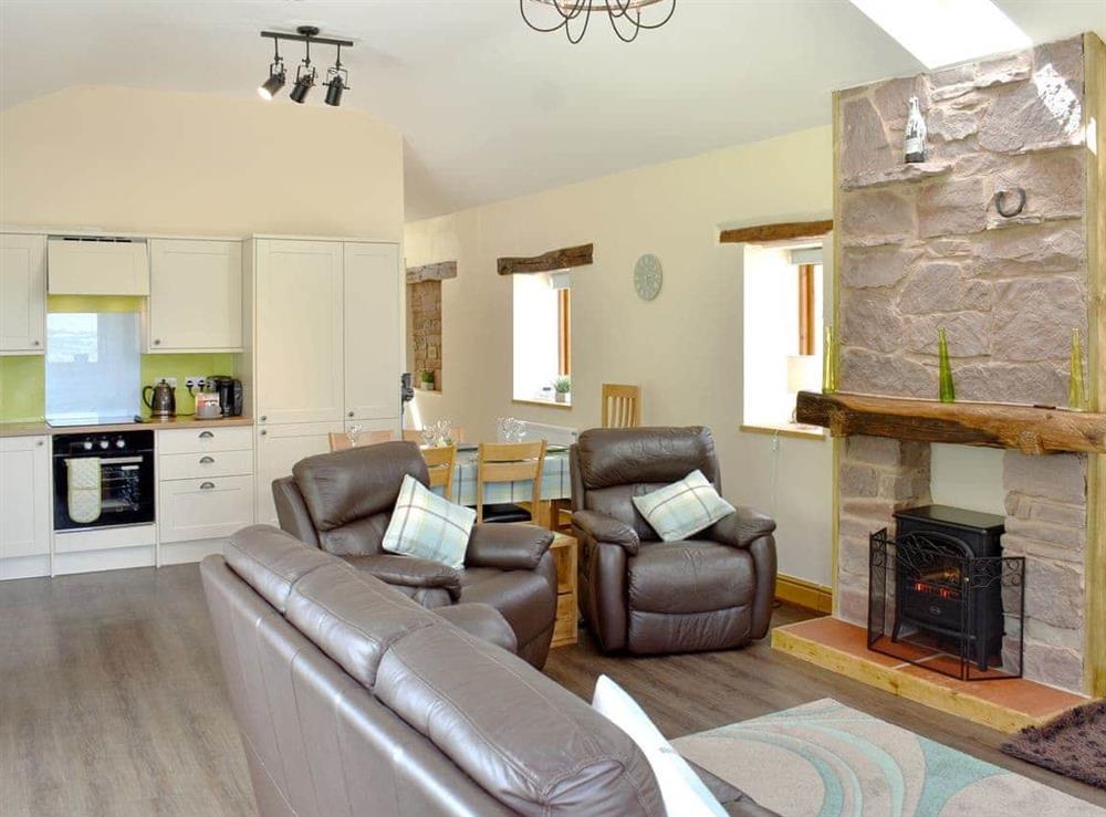 Open plan living space (photo 2) at Wyndham Cottage in Ullock, near Cockermouth, Cumbria