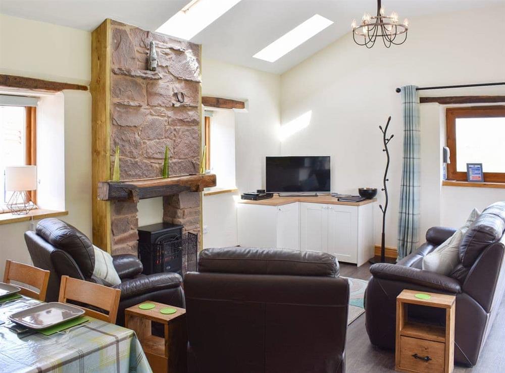 Open plan living space at Wyndham Cottage in Ullock, near Cockermouth, Cumbria