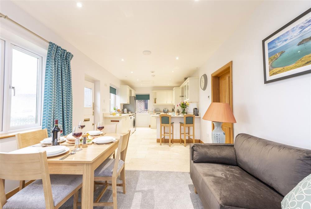 Open-plan sitting room, dining area and kitchen at Wyndthorpe Cottage, Milton Abbas