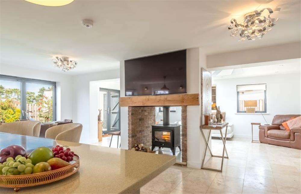Enjoy the dual-fronted wood burning stove at Wynholme, Holme-next-the-Sea