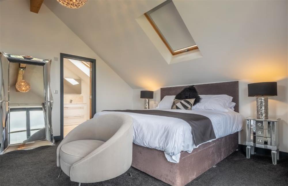 Spacious bedroom one with en-suite shower room at Wynholme, Holme-next-the-Sea