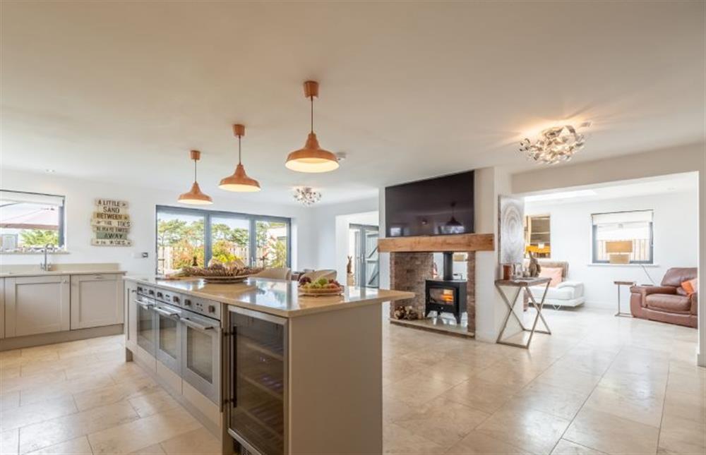 The open-plan kitchen and dining area leads into the garden room at Wynholme, Holme-next-the-Sea