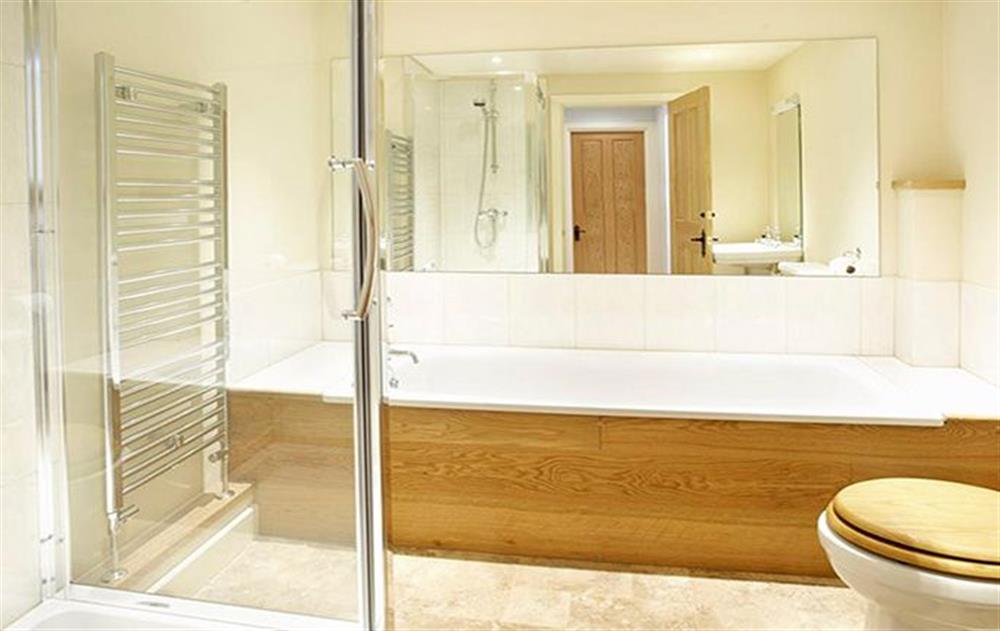 En-suite bathroom with a separate power shower to double bedroom with 5’ bed at Wythburn Cottage, Nr Greystoke