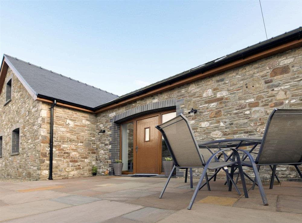 Patio with seating area at Y Beudy Bach in Pontyberem, near Kidwelly, Dyfed