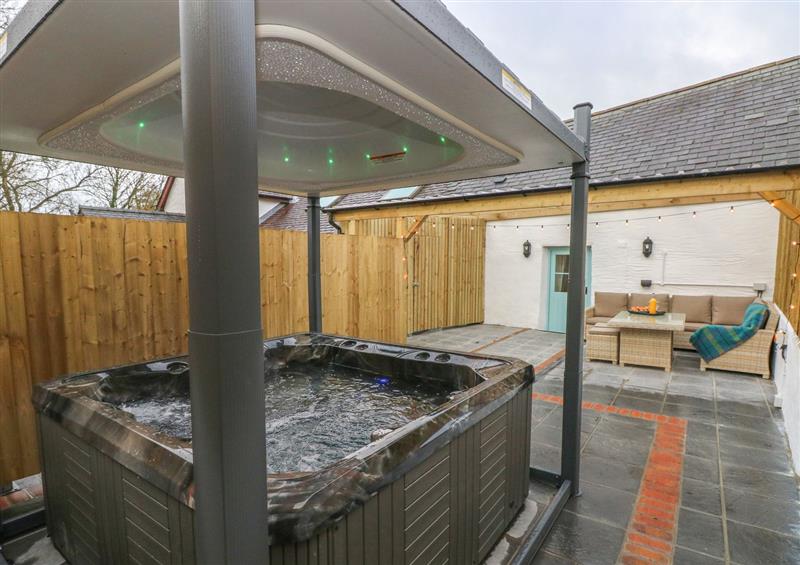 Spend some time in the hot tub (photo 2) at Y Beudy, Crosswell