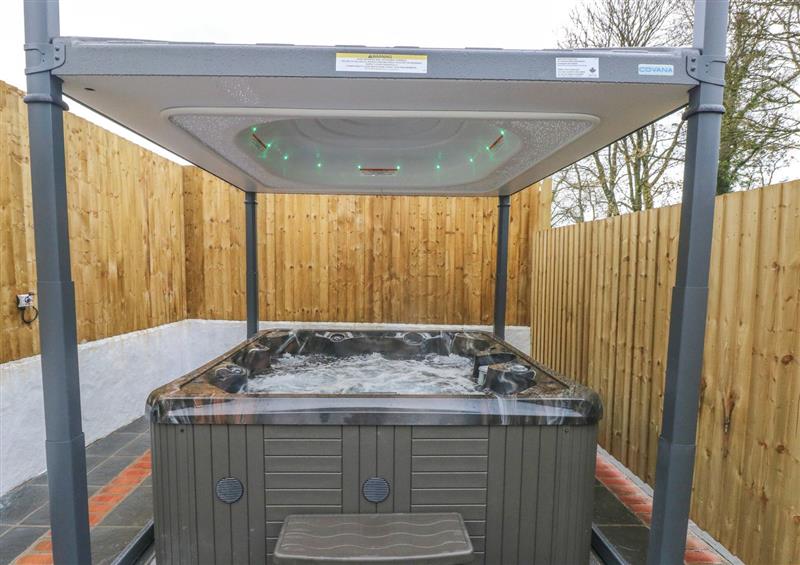 Spend some time in the hot tub at Y Beudy, Crosswell