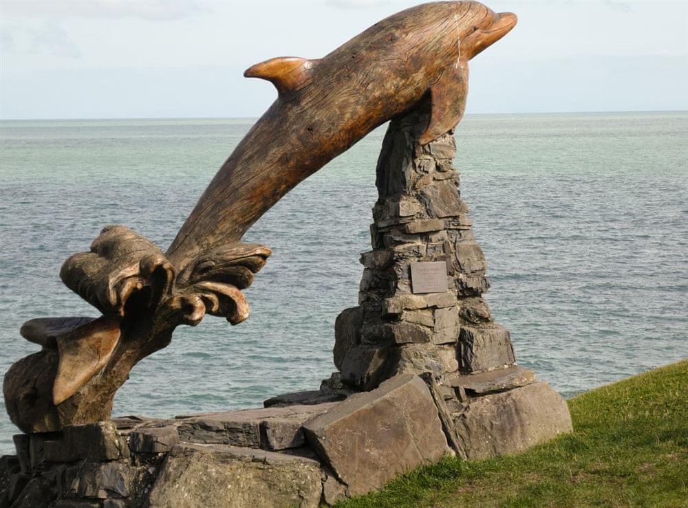 Dolphin statue at Aberporth at Y Bwthyn in Talgarreg, near New Quay, Cardigan/Ceredigion, Dyfed