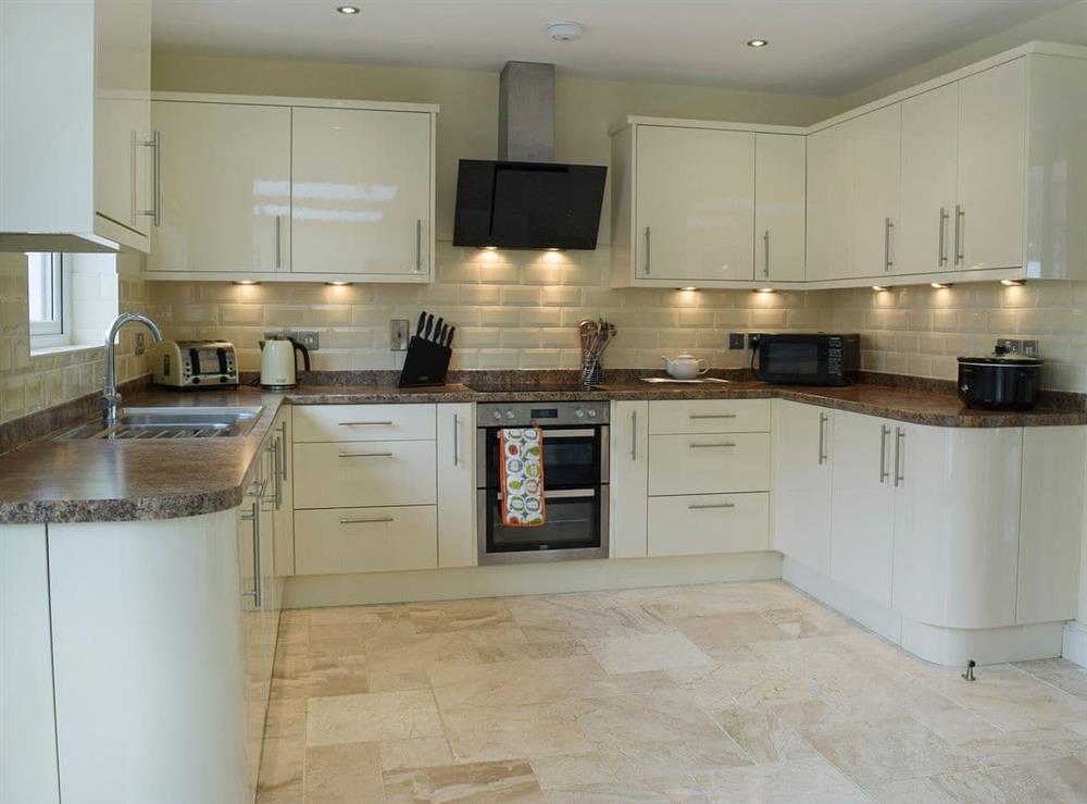 Open plan galley style kitchen at Y Hendy Llaeth in Red Roses, near Whitland, Dyfed