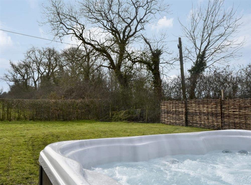 Views over fields and woods from the hot tub at Y Potel Inc in Dwyran, Anglesey., Gwynedd