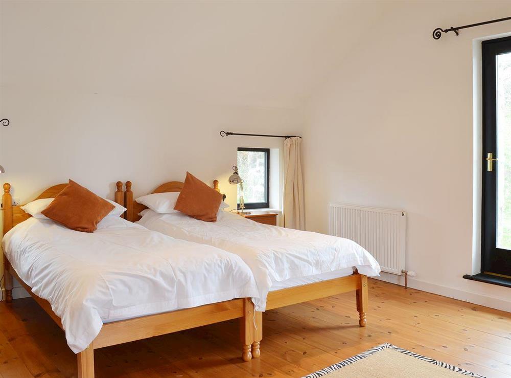 Oak floored twin bedroom at Y Stabl in Bethlehem, Carmarthenshire