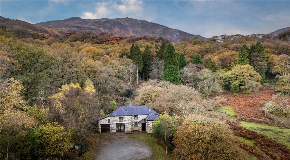 An aerial view of Watkin Bunkhouse, with mountains in the background, Gwynedd at Y Wenallt in Beddgelert, North Wales
