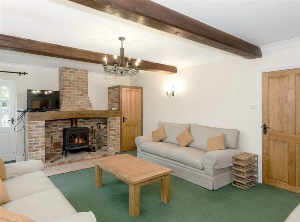 Warm and welcoming living room at Yaffle Cottage in Graffham, near Petworth, West Sussex