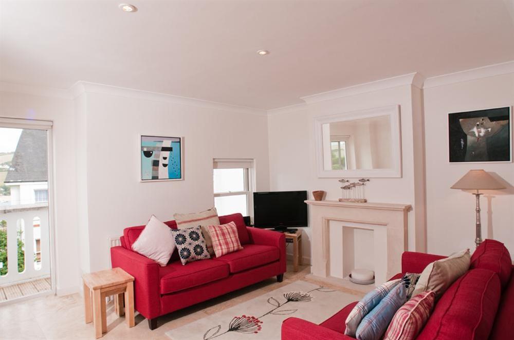Living area with patio doors to small balcony at Yardarm in 42 Devon Road, Salcombe