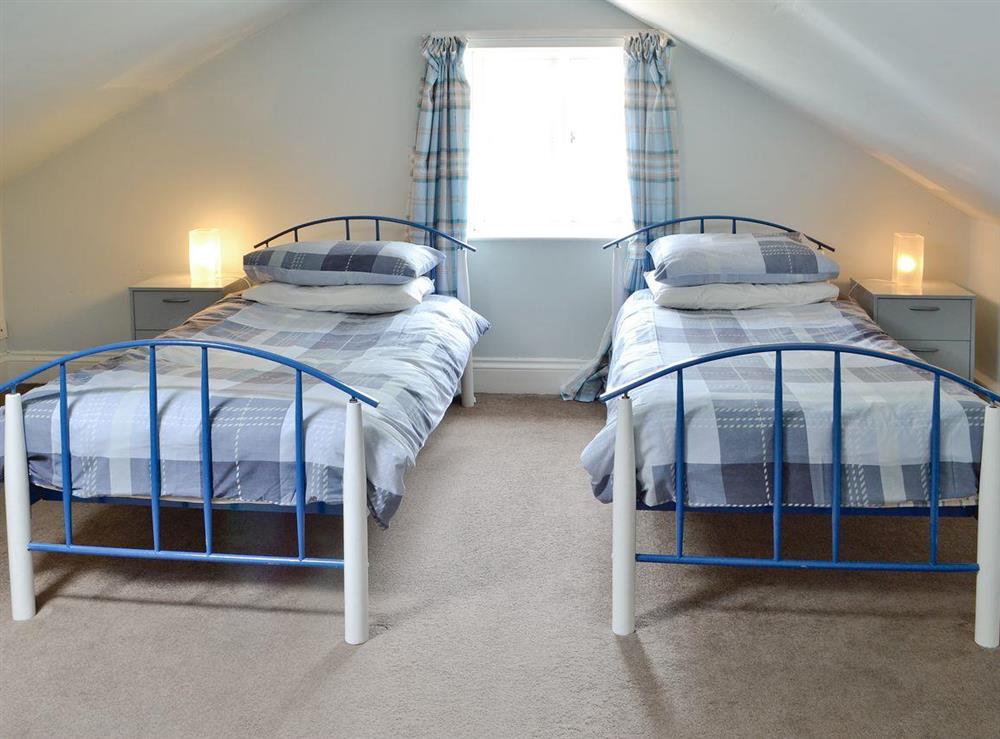 Upper floor twin bedroom at Yawl House in Uplyme, near Lyme Regis, Devon