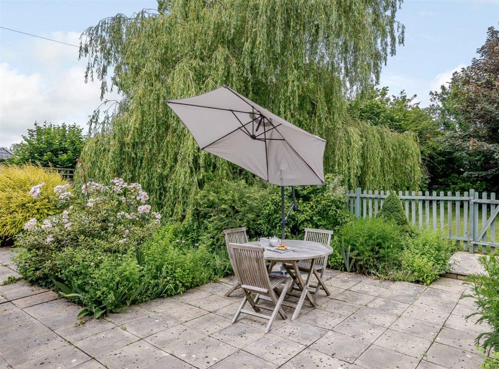 Lovely patio area with outdoor furniture at Coachmans Cottage, 