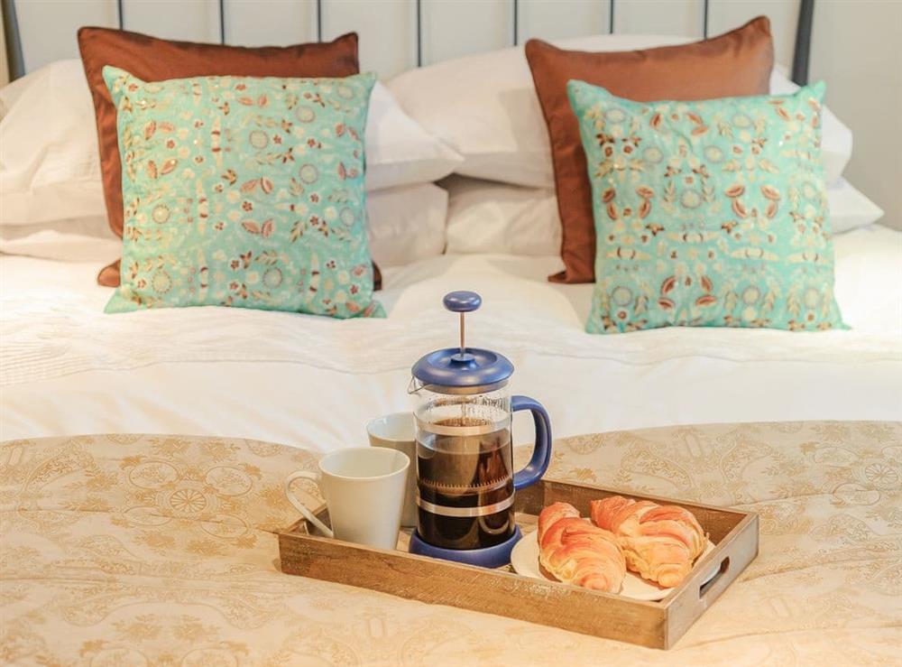 The bedroom makes an ideal place in which to take a leisurely breakfast at Coachmans Cottage, 