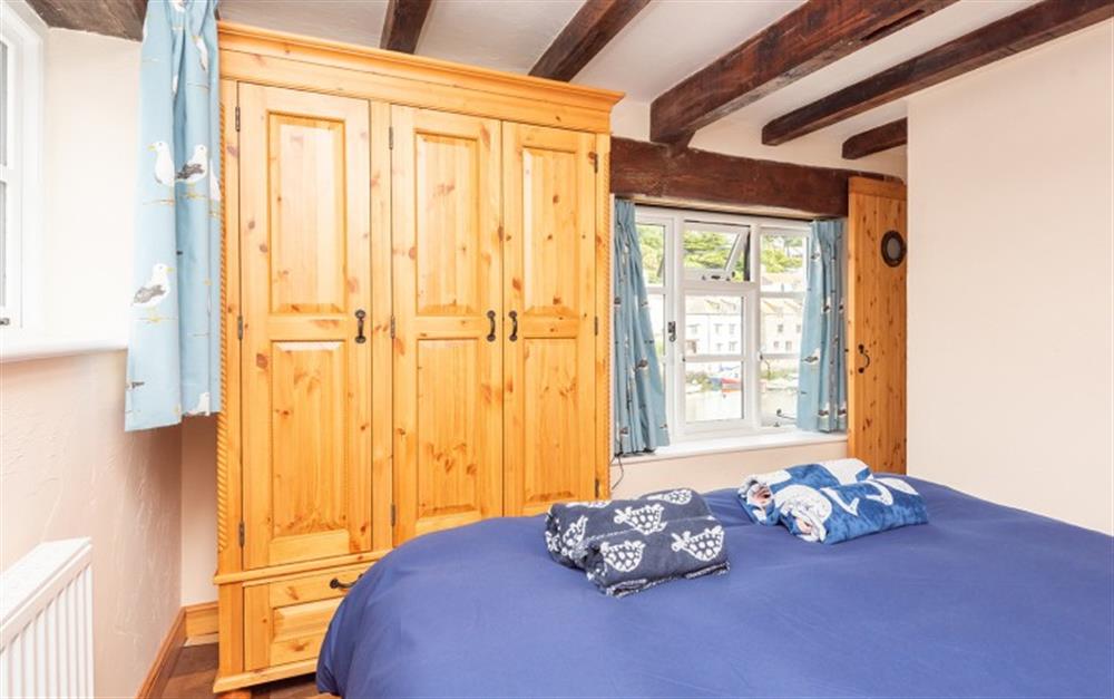Bedroom with water bed and harbour views at Ye Olde Bark House in Polperro