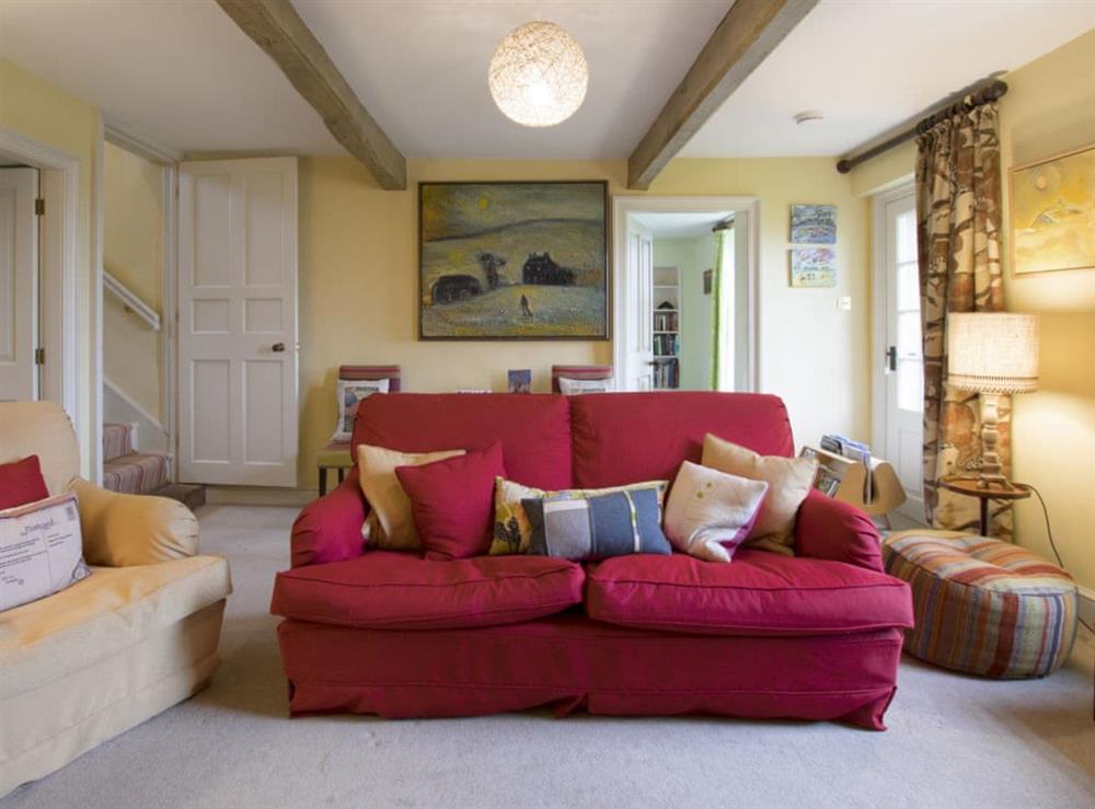 Exposed wooden beams and comfy seating in the living room at Yellison in Broughton, near Skipton, North Yorkshire