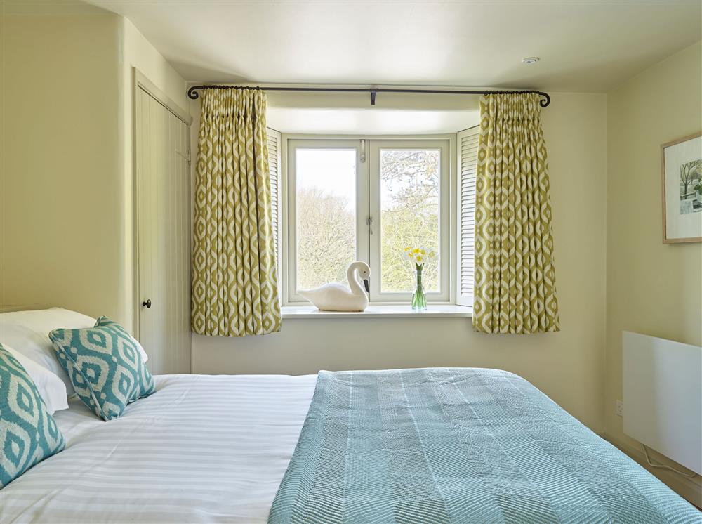 Bedroom one, with a 4’6 double bed at Yennadon Cottage, Dartmouth
