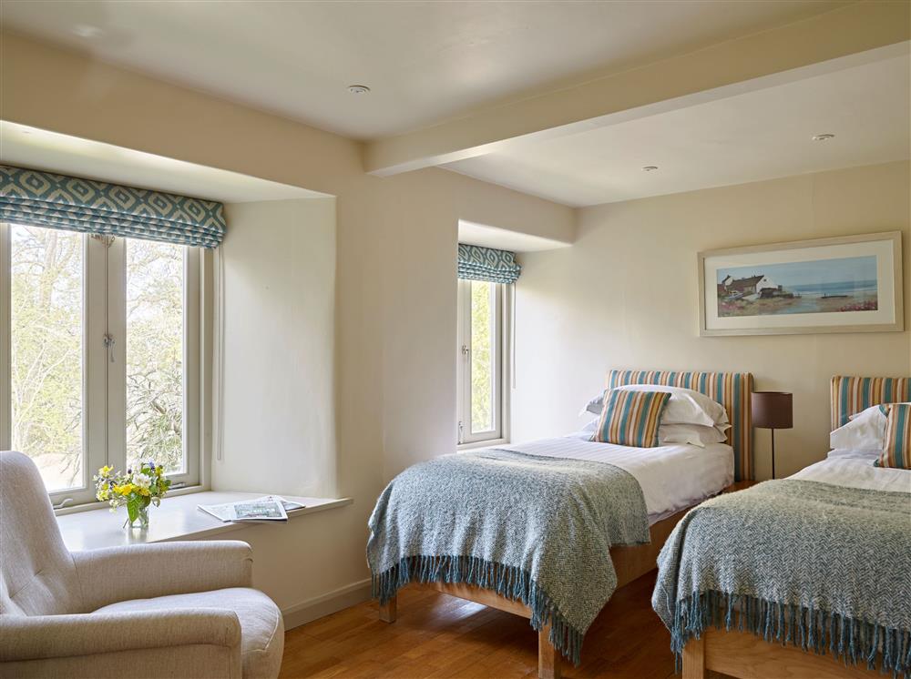 Bedroom two, with 3’ twin single beds at Yennadon Cottage, Dartmouth