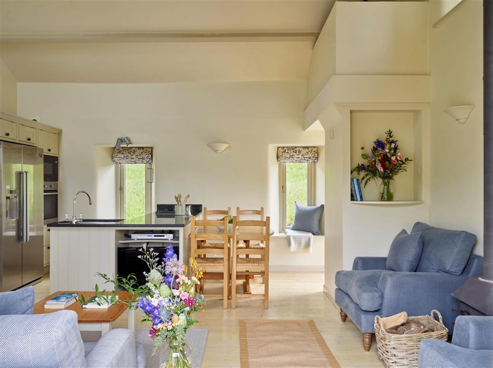 The open-plan sitting, dining and kitchen area at Yennadon Cottage, Dartmouth