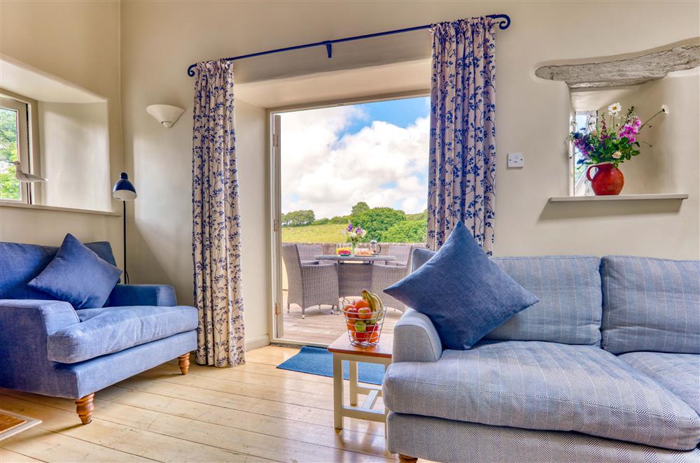 The sitting area with beautiful views across the Devon countryside at Yennadon Cottage, Dartmouth