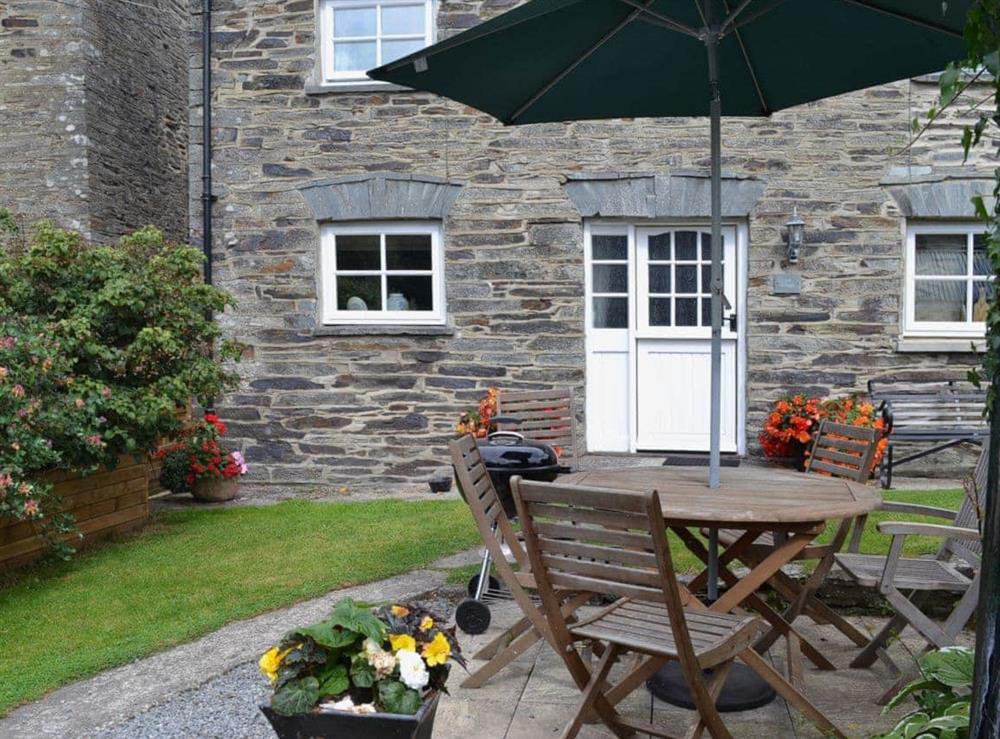 Lovely sheltered garden table and BBQ at Yet Farm Cottage in Cenarth, Dyfed., Great Britain