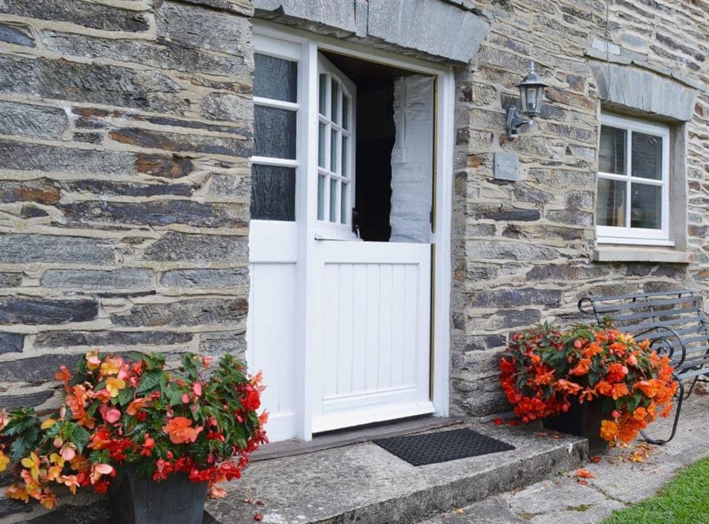 Stable door and attractive planting at Yet Farm Cottage in Cenarth, Dyfed., Great Britain