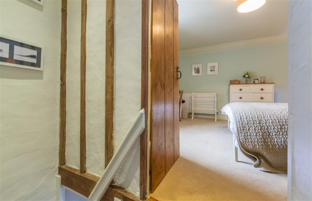 First floor:  Landing with door to master bedroom at Yew Tree Cottage, Blakeney near Holt