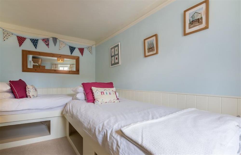 First floor:  Twin bedroom with colourful cushions at Yew Tree Cottage, Blakeney near Holt