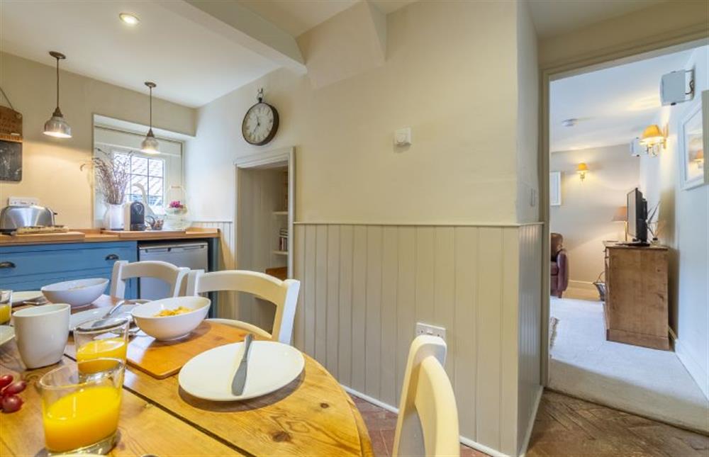 Ground floor:  Dining area with door leading to sitting room at Yew Tree Cottage, Blakeney near Holt