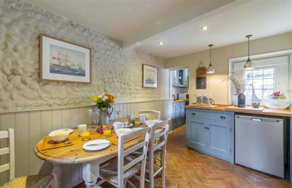 Ground floor:  Dining area with table and seating for four at Yew Tree Cottage, Blakeney near Holt