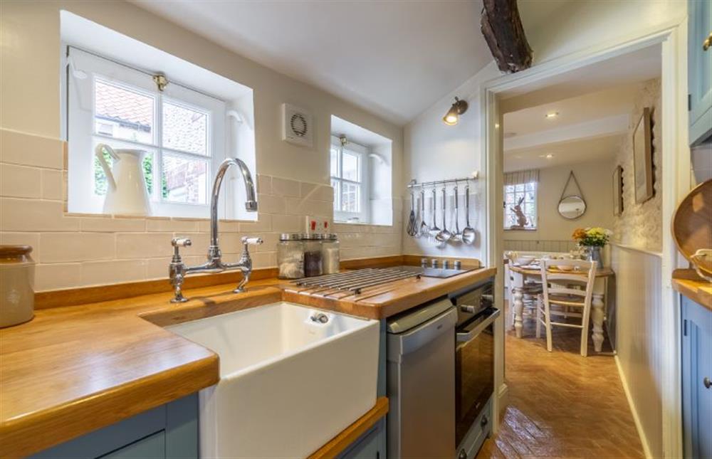 Ground floor:  Kitchen with Butlerfts sink, electric oven and ceramic hob at Yew Tree Cottage, Blakeney near Holt