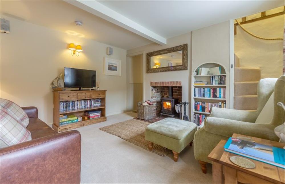 Ground floor:  Sitting room with comfy seating and wood burning stove at Yew Tree Cottage, Blakeney near Holt