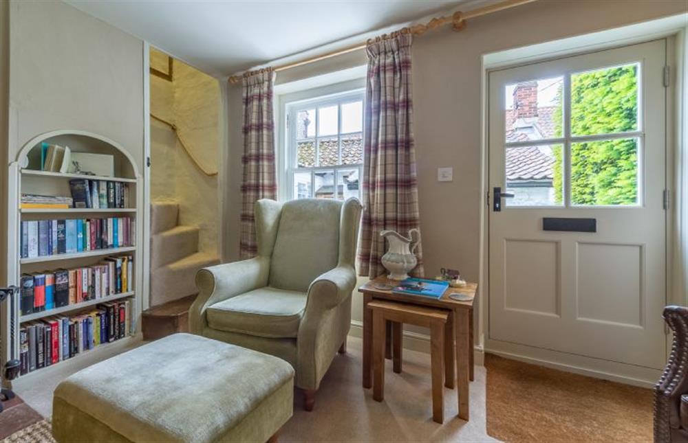 Ground floor:  Sitting room with feature bookshelves at Yew Tree Cottage, Blakeney near Holt