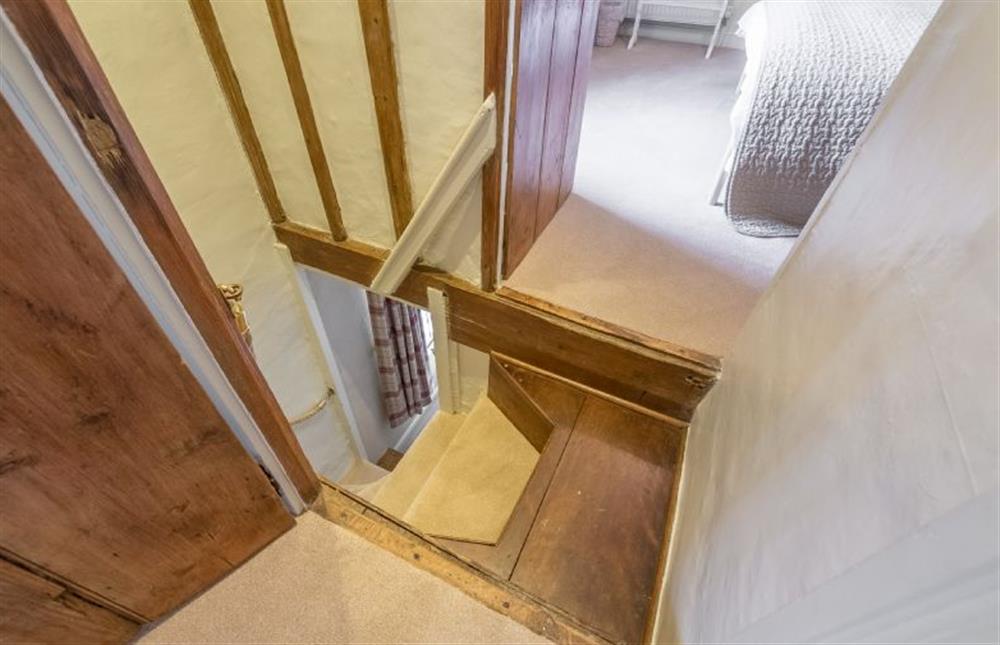 Ground floor:  Steep Norfolk winder stairs to first floor at Yew Tree Cottage, Blakeney near Holt