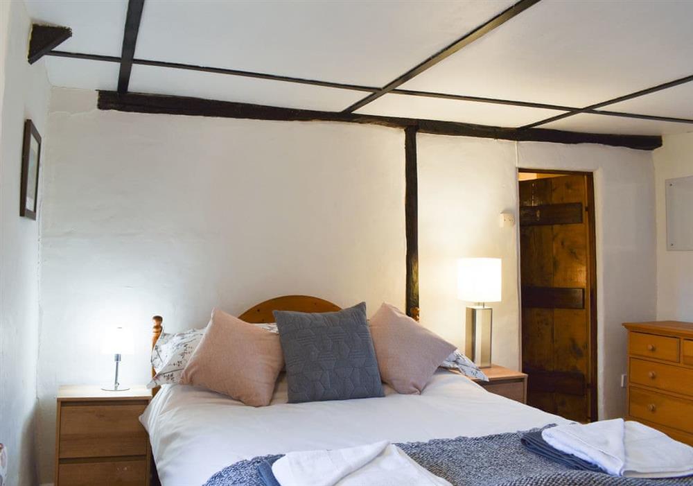 Bedroom with exposed woodwork at Yew Tree Cottage in Farnham, near Blandford Forum, Dorset
