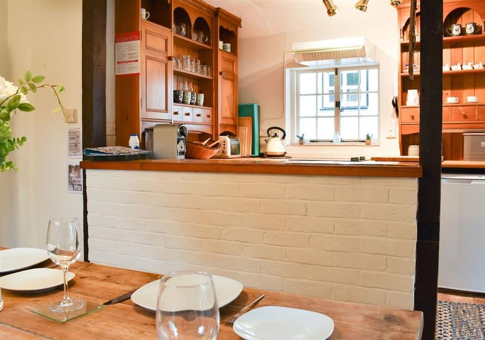 Lovely dining area overlooked by the kitchen at Yew Tree Cottage in Farnham, near Blandford Forum, Dorset