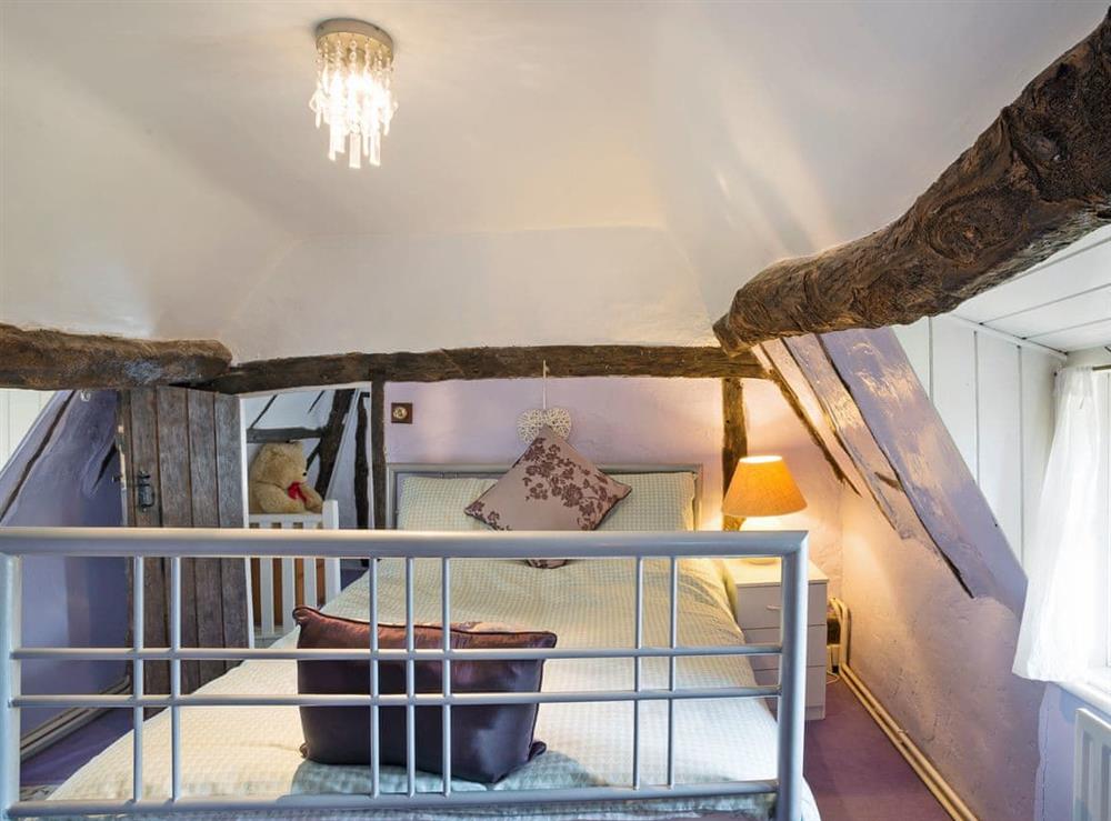 Convenient double bedroom leading to nursery at Yew Tree Cottage in Moulsoe, near Milton Keynes, Buckinghamshire