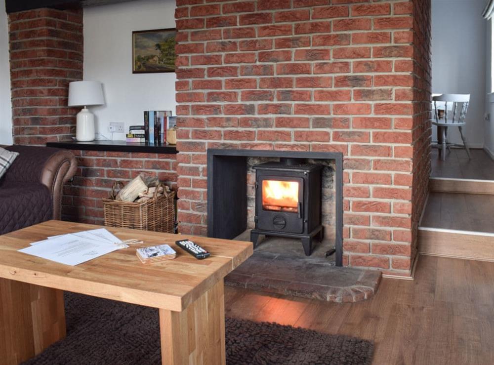Living room with wood burner (photo 2) at Yew Tree Cottage in West Ayton, near Scarborough, North Yorkshire