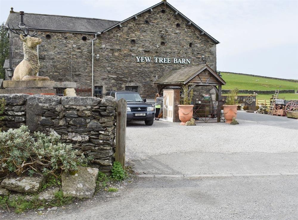 Main entrance from the road to the holiday cottage which goes past this antiques and reclamation barn with cafe at Yew Tree Farm in Low Newton, Cumbria