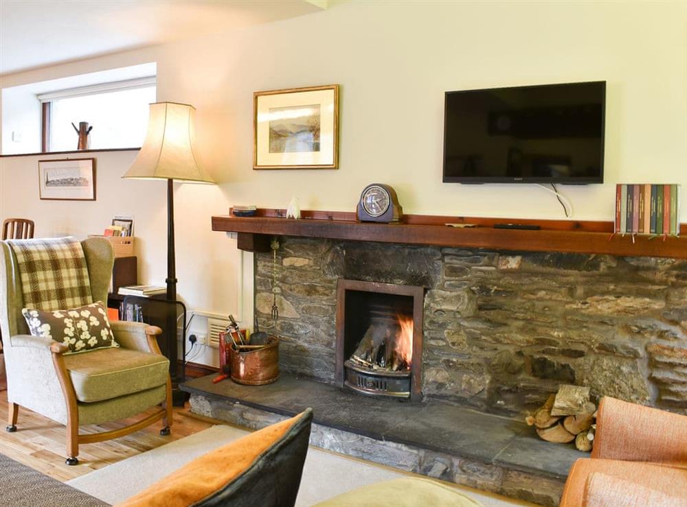 Wonderful feature fireplace with open fire at Yew Tree Farm in Low Newton, Cumbria
